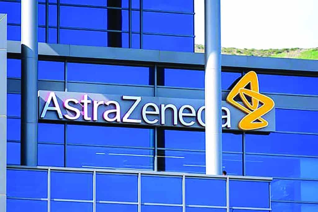 AstraZeneca logo on modern blue glass building exterior.