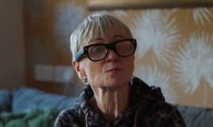Woman wearing Cross Sense smart specs, winners of the Longitude dementia innovation award.