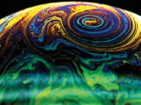 Soap bubbles in a spin